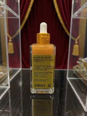 TRULY Dulce de Leches Firming Serum Bottle in Orange and White